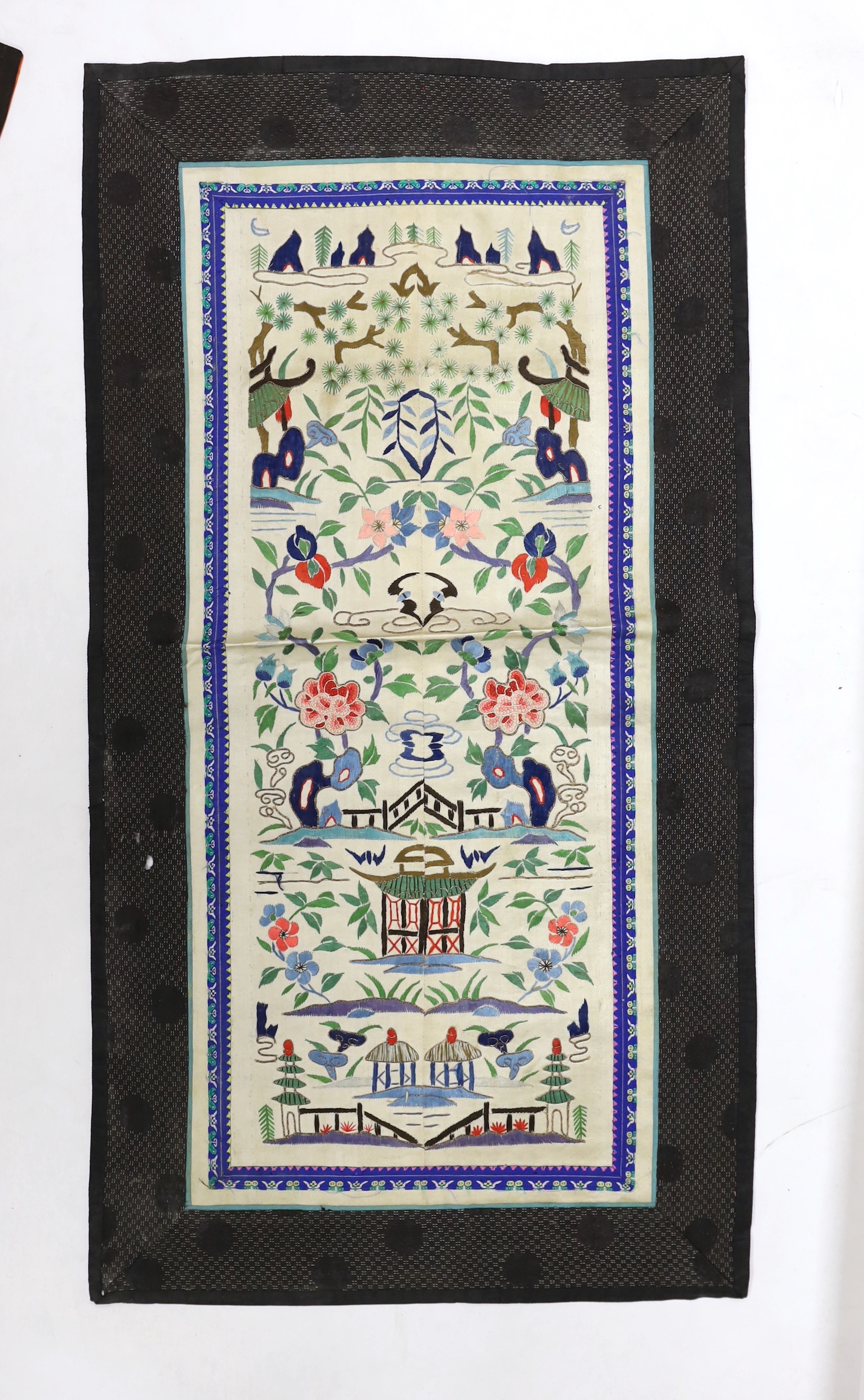Three pairs of Chinese embroidered sleeve bands, polychrome silk designs on cream silk background, together with a single sleeve band, all bordered with damask silk, longest panel including border 66cm x 35cm wide